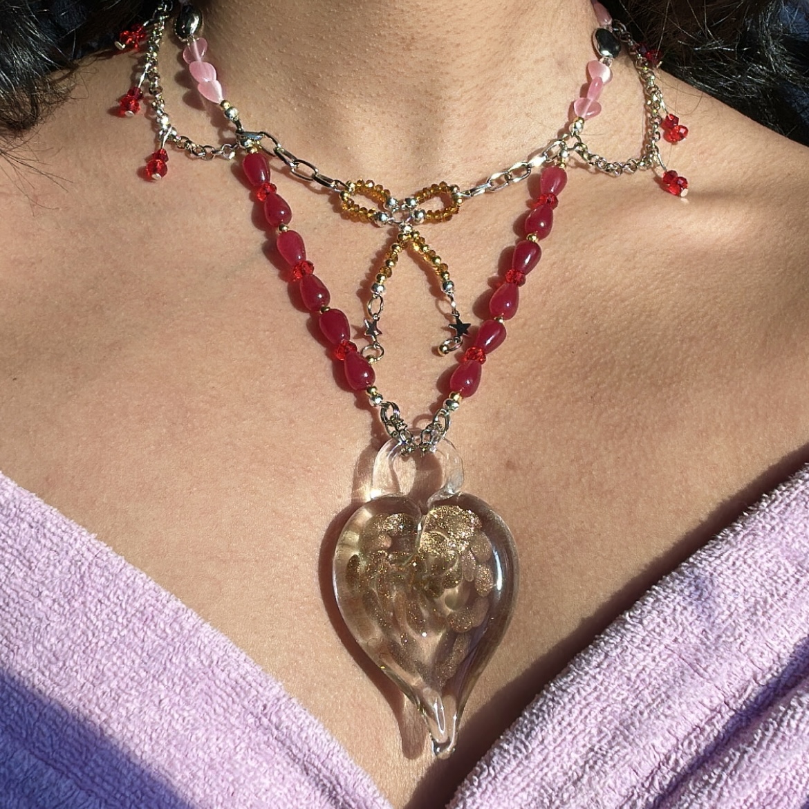 beaded necklace with handmade gold and transparent glass heart pendant